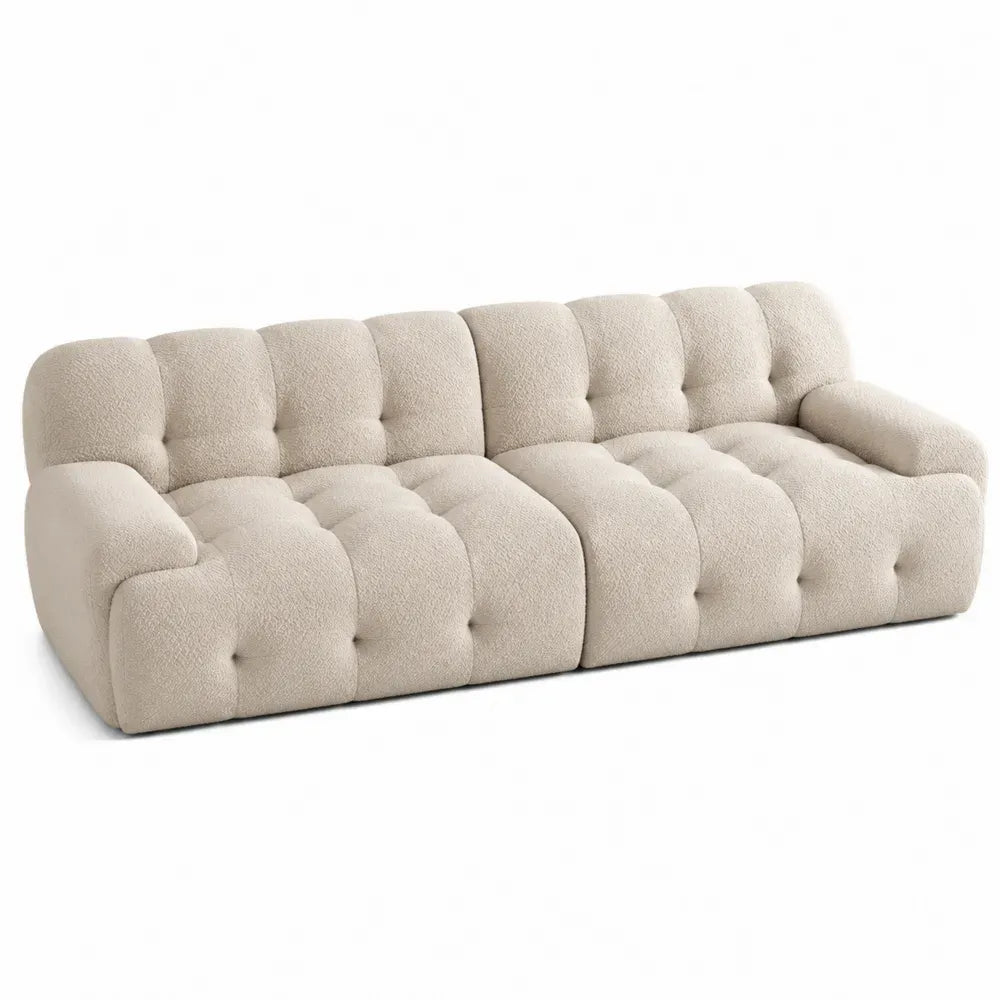 Sofá de 3 plazas tapizado en tejido bouclé beige con respaldo capitoné y brazos integrados 240 x 95 x 70 cm